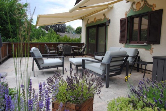 Roof terrace with lounge furniture, lavender and awning